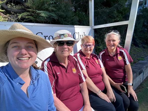 Four women, three in maroon croquet club uniforms, pose together at a croquet club event